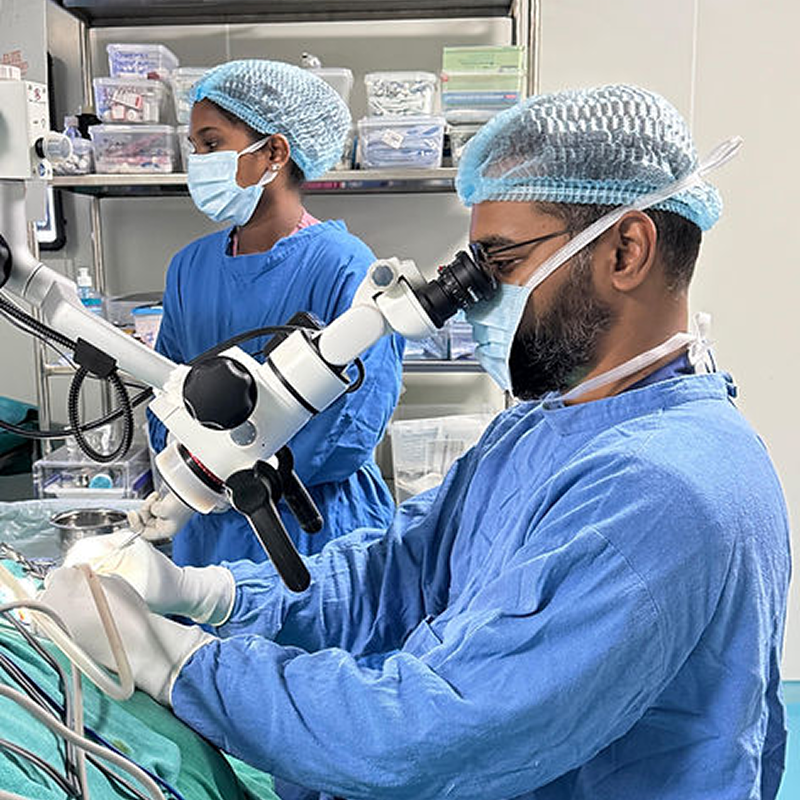 Dr. Nikhilesh performing high-precision endoscopic ENT procedure in surgical theatre